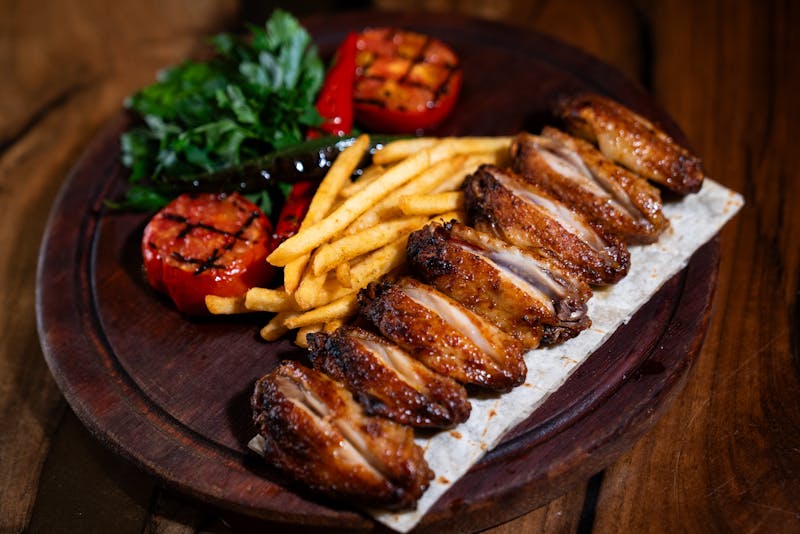 Buffet setup with hot food stations at large event